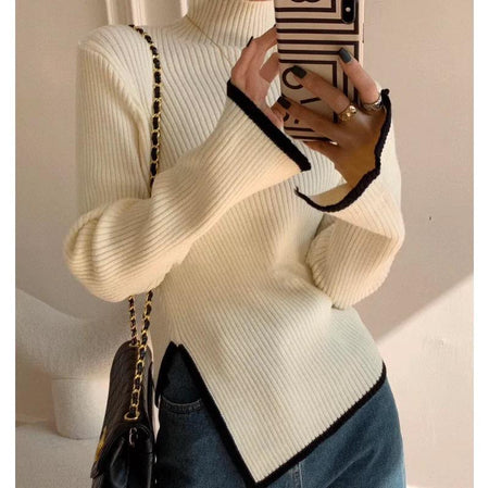 Eliana Woolen Sweater - close-up of split hem detail on model, cream and black - Miss Mosa By Akanksha