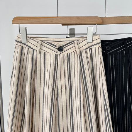 Elon Statement Striped Pants In Beige - close-up shot of waistband and button detail on hanger - Miss Mosa By Akanksha
