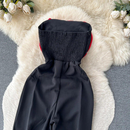 Emmy Off-Shoulder Jumpsuit In Red - close-up of smocked bodice, black - Miss Mosa By Akanksha