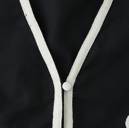 Emy Luxe Soft Knit Dress In Black - close-up of neckline and button detail - Miss Mosa By Akanksha