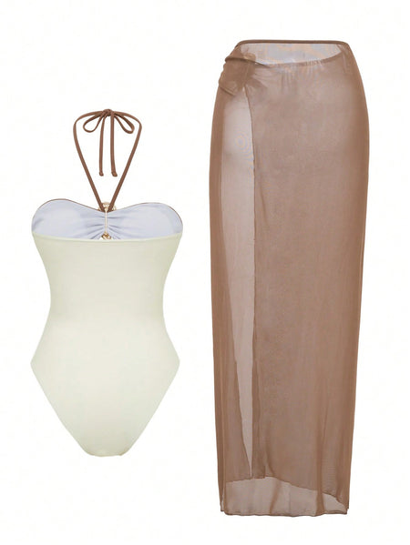 Erica Cutout Swimsuit With Skirt - fabric detail shot, brown and beige colourblock with gold shell trim - Miss Mosa By Akanksha
