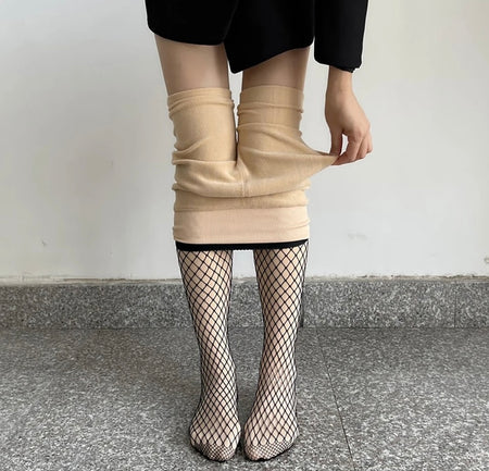 Fishnet Fleece Lined Stockings - Limited Edition - back shot of legs on model, black - Miss Mosa By Akanksha