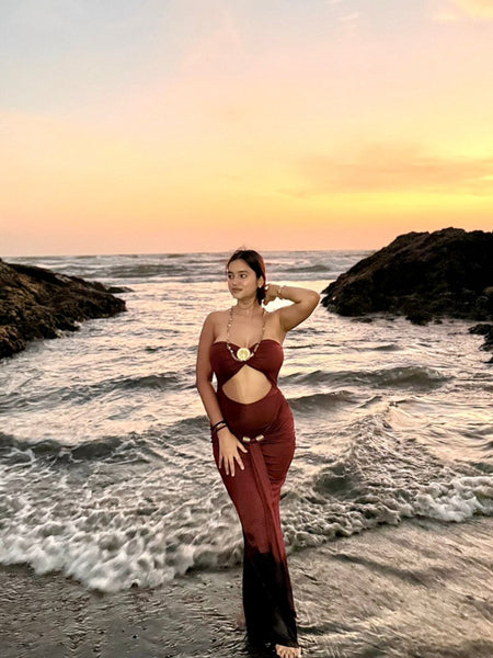 Freza Bodycon Maxi Dress In Rust - full-length shot on model on beach - Miss Mosa By Akanksha
