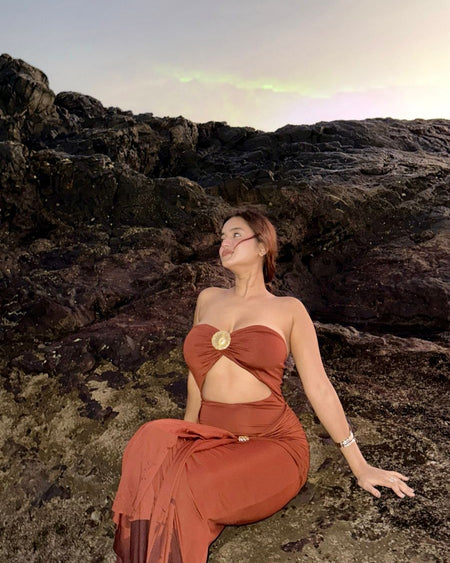 Freza Bodycon Maxi Dress In Rust - seated shot on model - Miss Mosa By Akanksha