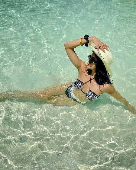 Giza Swimsuit with Sarong Skirt In Black - lifestyle shot on model, black - Miss Mosa By Akanksha