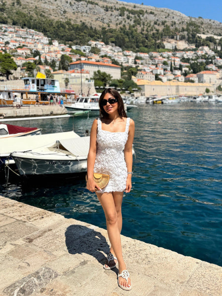 Hanel Luxe 3D Floral Dress In White - full-length shot on model at harbour - Miss Mosa By Akanksha