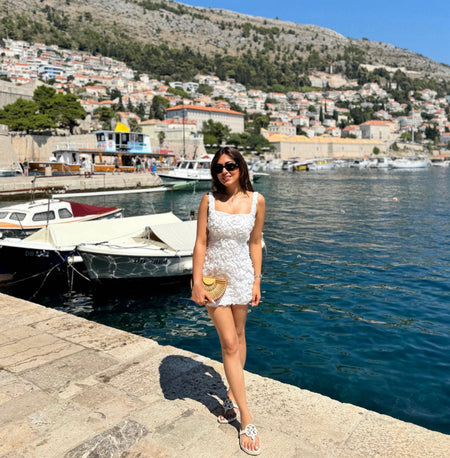 Hanel Luxe 3D Floral Dress In White - full-length shot on model at harbour - Miss Mosa By Akanksha