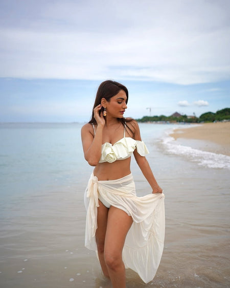 Hannah Swimsuit with Sarong Skirt - side shot on model on boat, cream - Miss Mosa By Akanksha