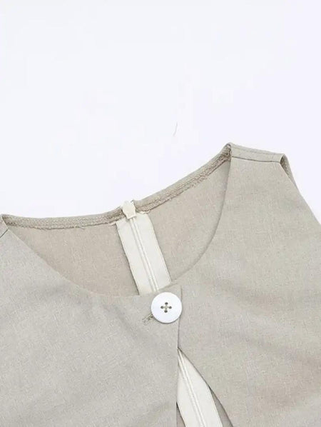 Harlow Statement Dropwaist Midi Dress - close-up shot of the neckline and button detail, beige - Miss Mosa By Akanksha