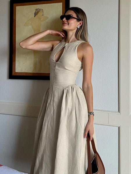 Harlow Statement Dropwaist Midi Dress - side shot on model indoors, beige - Miss Mosa By Akanksha
