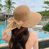 Harry Summer Holiday Straw Hat - styling shot on model outdoors, beige - Miss Mosa By Akanksha