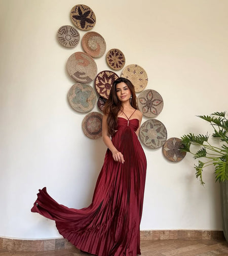 Hay Luxe Pleated Flowy Maxi Dress In Maroon - full-length front shot on model against a basket wall - Miss Mosa By Akanksha