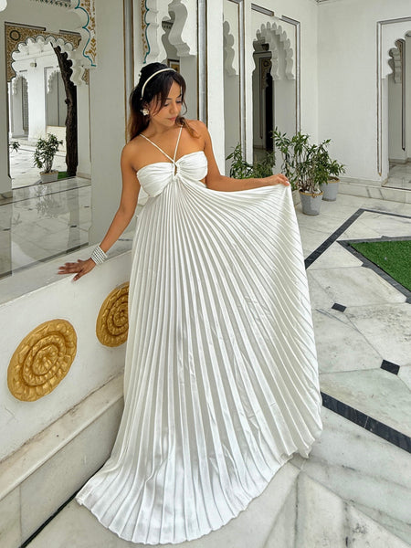Hay Luxe Pleated Flowy Maxi Dress In White - full-length front shot on model holding the pleated skirt out - Miss Mosa By Akanksha