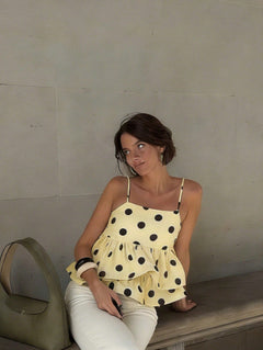 Hola Polka Top - seated front shot, pale yellow with black polka dots - Miss Mosa By Akanksha