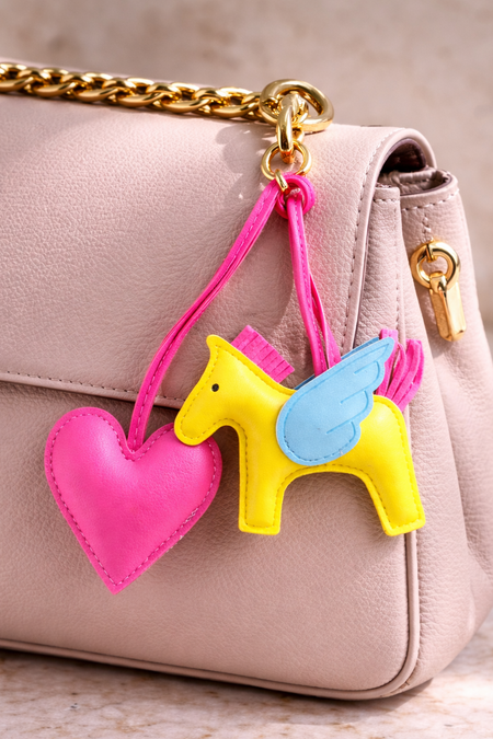 Horse and Heart Set of 2 Bag Charms - lifestyle shot of charms on a beige bag, pink and yellow - Miss Mosa By Akanksha