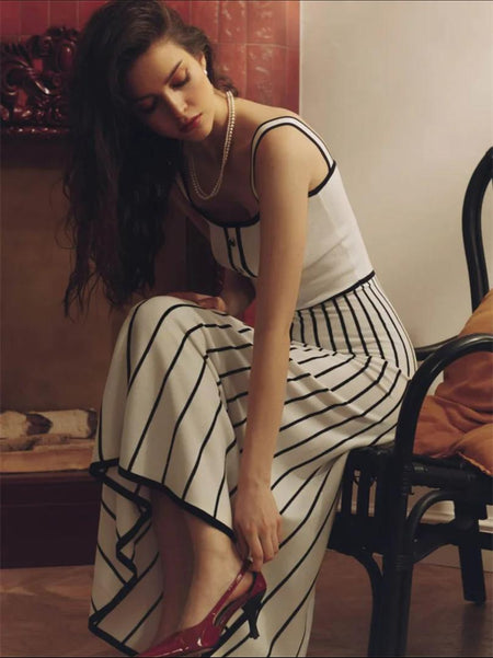 Irica Striped Soft Knit Dress In White - seated side shot on model - Miss Mosa By Akanksha