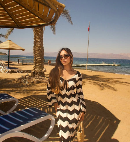 Jerrica Soft Knit Holiday Dress In Black - front shot on model at beach - Miss Mosa By Akanksha