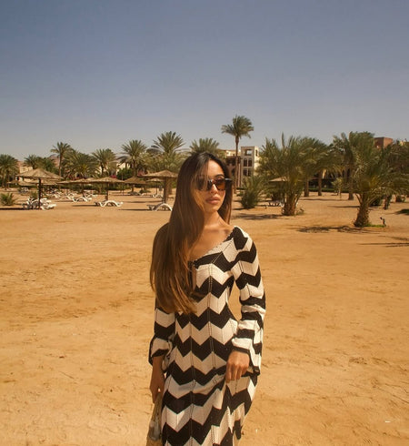 Jerrica Soft Knit Holiday Dress In Black - front shot on model outdoors - Miss Mosa By Akanksha