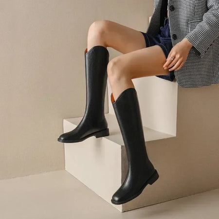 Jonas Knee High Premium Leather Boots - side shot on model seated, black - Miss Mosa By Akanksha