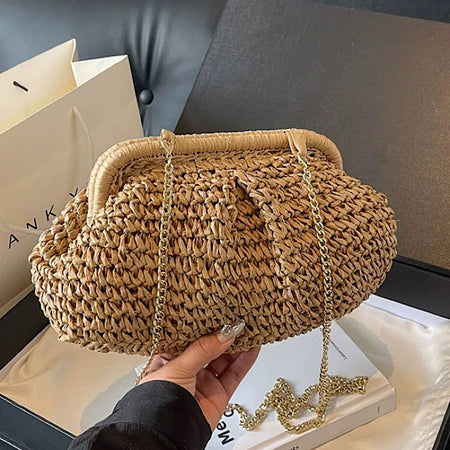 Jovie Straw Hand Bag With Chain - close-up shot held in hand, tan brown woven straw with gold chain - Miss Mosa By Akanksha