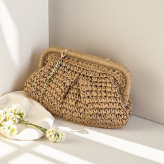 Jovie Straw Hand Bag With Chain - angled shot, tan brown woven straw with gold chain - Miss Mosa By Akanksha