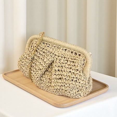 Jovie Straw Hand Bag With Chain - angled shot, natural beige woven straw with gold chain - Miss Mosa By Akanksha