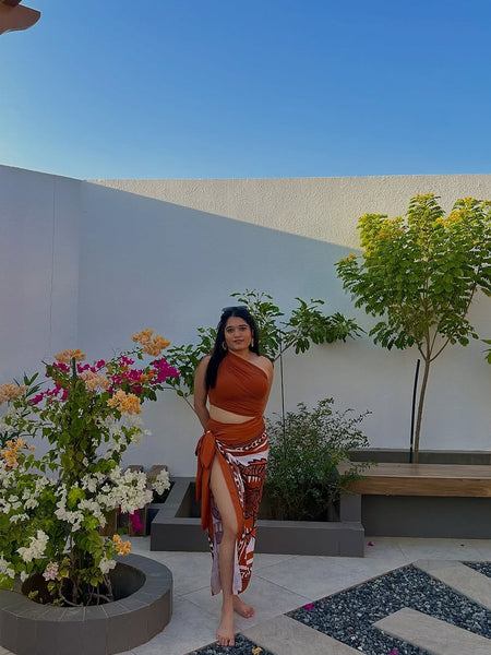 Kairo Luxe Swimsuit with Sarong Skirt In Rust - lifestyle shot on model, rust - Miss Mosa By Akanksha