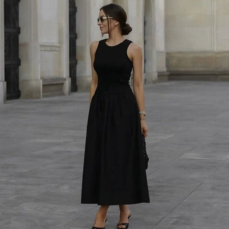 Keya Drop Waist Midi Dress - full-length side shot on model outdoors, black - Miss Mosa By Akanksha