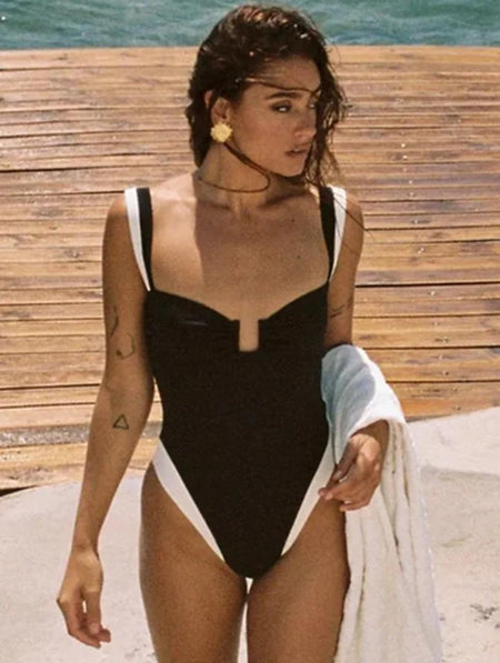 Kyle One Piece Swimsuit In Black - front shot on model on the beach - Miss Mosa By Akanksha