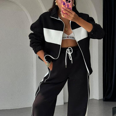 Kyler Premium Tracksuit - front shot on model with bag, beige - Miss Mosa By Akanksha