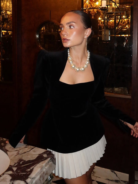 Liona Luxe Mini Dress - seated shot, black and white - Miss Mosa By Akanksha