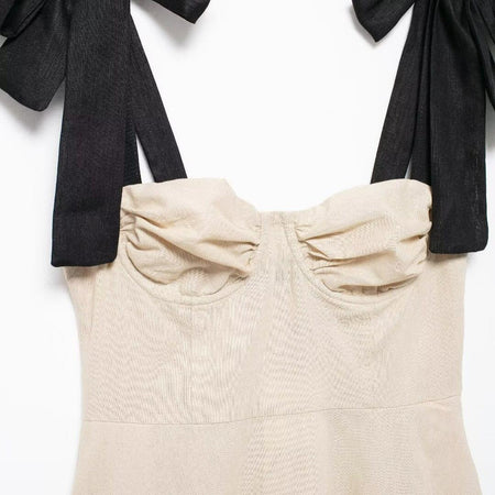 Liza Statement Mini Dress In Beige - close-up of bust and bow straps - Miss Mosa By Akanksha