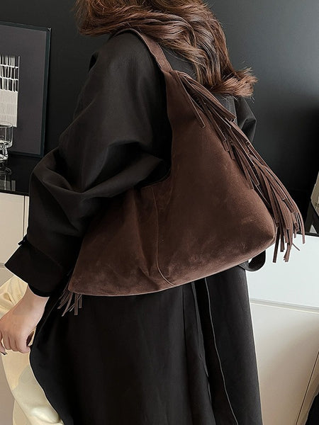 Luc Fringe Suede Tote Bag - shoulder-carry shot on model, dark brown - Miss Mosa By Akanksha