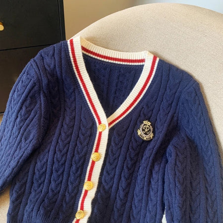 Luisa Woolen Cardigan In Navy Blue - close-up shot of neckline and crest badge - Miss Mosa By Akanksha