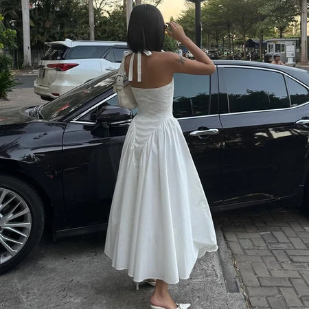 Maira Drop Waist Midi Dress in White - back shot on model, white - Miss Mosa By Akanksha