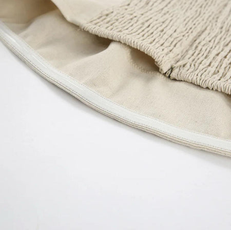 Maisie Offshoulder Holiday Tube Dress In Beige - close-up of shirred back panel detail - Miss Mosa By Akanksha