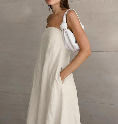 Maisie Offshoulder Holiday Tube Dress In Beige - side shot on model showing knotted strap detail - Miss Mosa By Akanksha