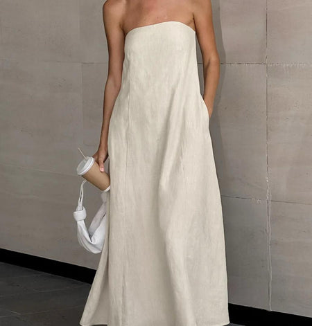 Maisie Offshoulder Holiday Tube Dress In Beige - full-length front shot on model holding a cup - Miss Mosa By Akanksha