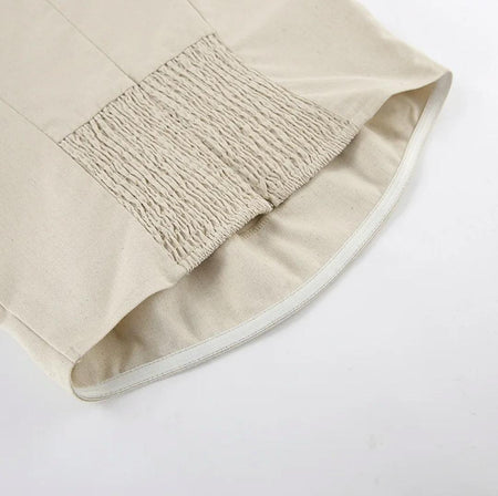 Maisie Offshoulder Holiday Tube Dress In Beige - close-up of shirred hem detail - Miss Mosa By Akanksha