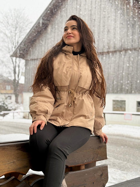 Margot Warm Fleece Lined Parka Jacket - front shot on model outdoors seated, beige - Miss Mosa By Akanksha