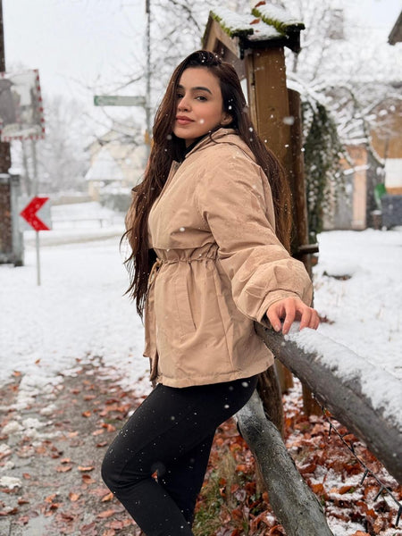 Margot Warm Fleece Lined Parka Jacket - front shot on model outdoors seated, beige - Miss Mosa By Akanksha