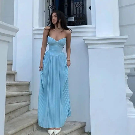 Mary Offshoulder Pleated Maxi Dress In Blue - full-length front shot on model on steps - Miss Mosa By Akanksha
