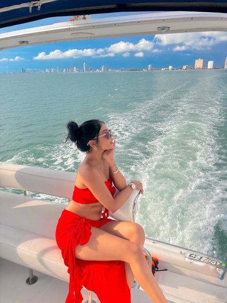 Mayne Summer Holiday Coord Set -Resortwear In Red - side shot on model on boat - Miss Mosa By Akanksha