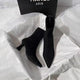 Meah Short Suede Statement Ankle Boots - front shot of pair flat-lay, black - Miss Mosa By Akanksha