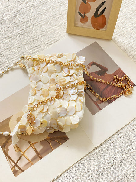 Mibi Shell Hand Bag With Chain - angled flat-lay packshot, cream mother-of-pearl shell with gold chain - Miss Mosa By Akanksha