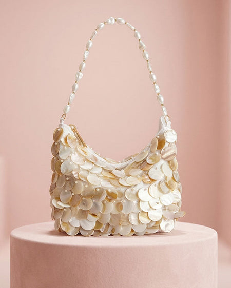 Mibi Shell Hand Bag With Chain - front shot on pedestal, cream mother-of-pearl shell with pearl beaded strap - Miss Mosa By Akanksha