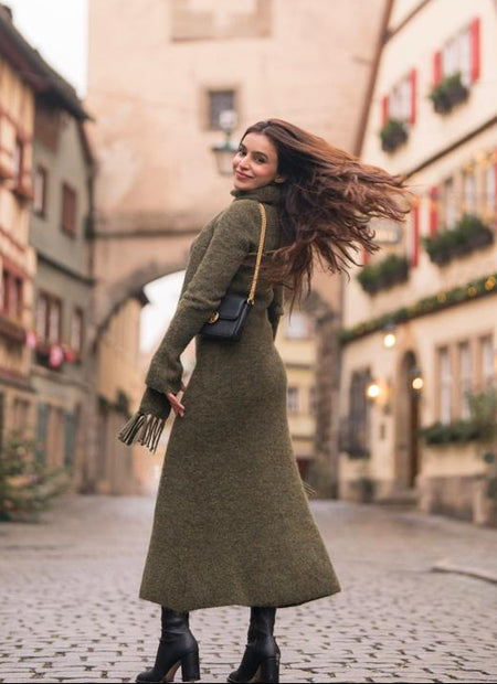 Micola Woolen Dress With Scarf In Olive - back shot on model in a street - Miss Mosa By Akanksha