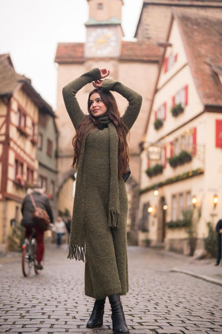 Micola Woolen Dress With Scarf In Olive - full-length shot on model in a street - Miss Mosa By Akanksha