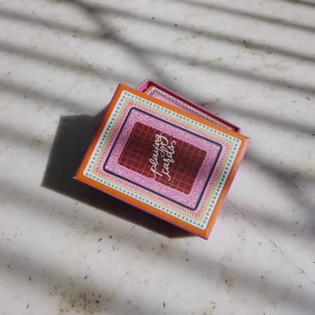 Miss Mosa Playing Cards- Diwali Edition - top-down shot of closed card box, multicolour pink and orange - Miss Mosa By Akanksha