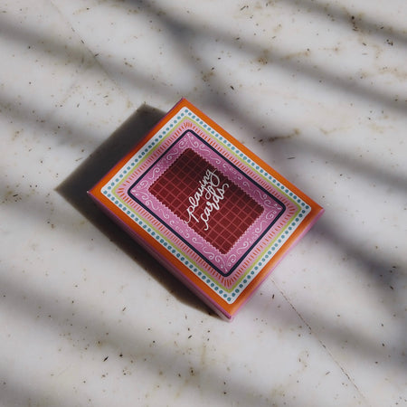 Miss Mosa Playing Cards- Diwali Edition - top-down shot of card box on marble, multicolour pink and orange - Miss Mosa By Akanksha